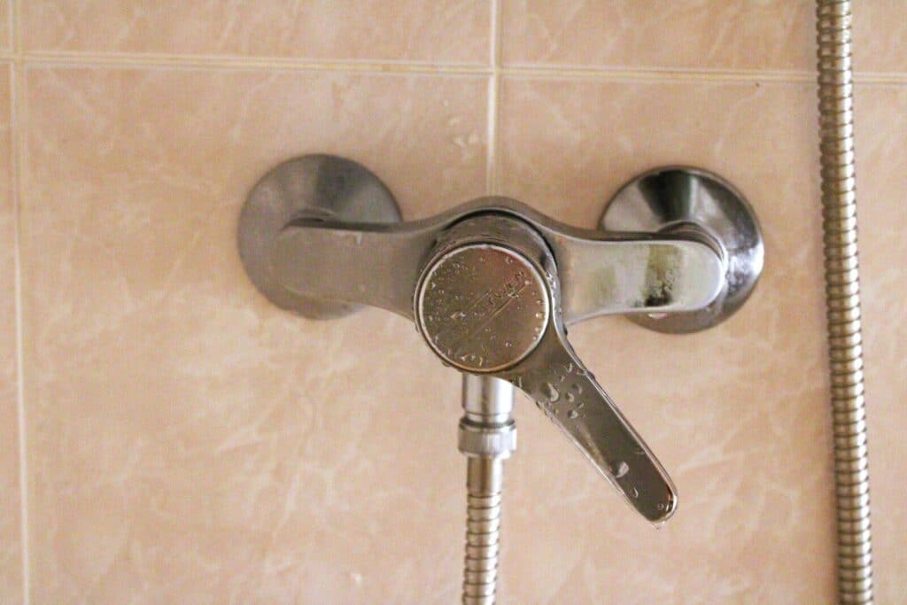 A shower faucet with a hand shower head